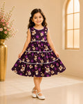 Front view of girl wearing Goodoo deep purple floral tiered frock