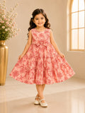 Front view of girl wearing Goodoo peach pink floral tiered frock